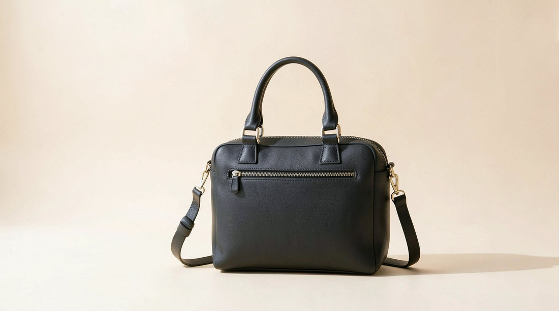 Black leather ita bag on a bright studio background